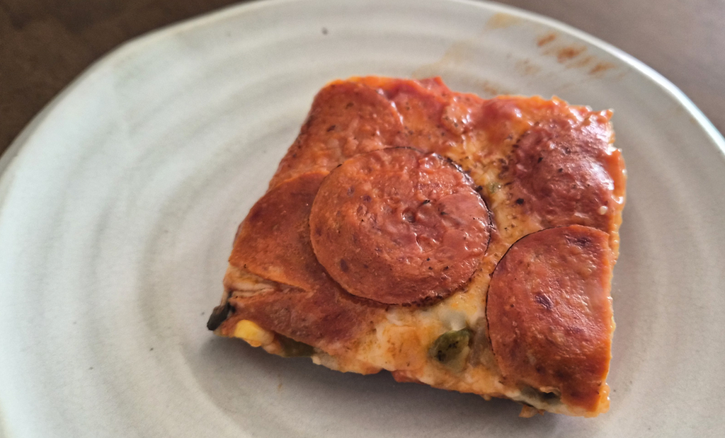 Pizza seolgi Korea with tomato sauce, cheese and savory toppings on steamed rice cake