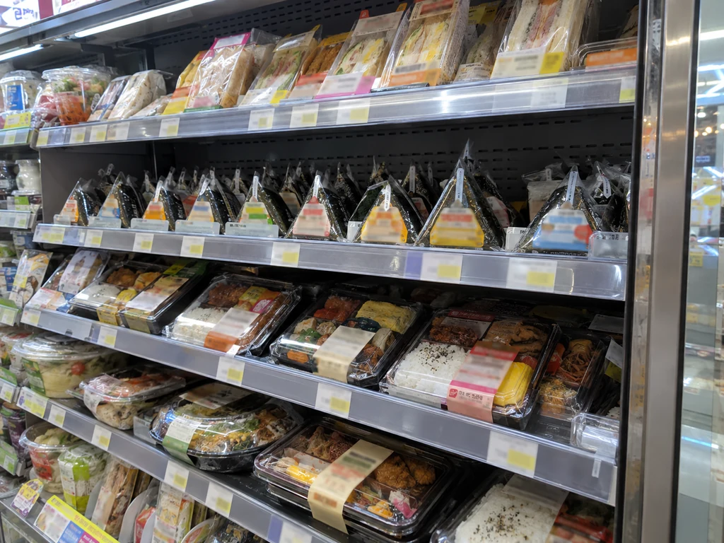 Dosirak, samgak gimbap and sandwiches in a Korean convenience store refrigerator